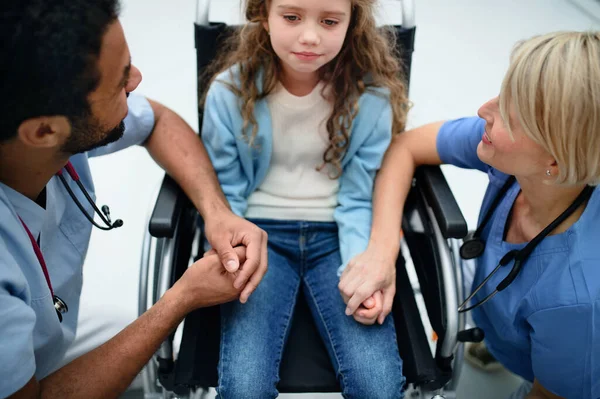 Young Multiracial Doctor His Colleague Consoling Little Girl Wheelchair — Stock Photo, Image