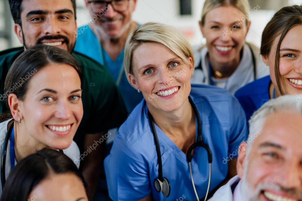Portrait of happy doctors, nurses and other medical staff in a hospital.