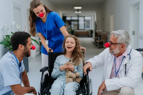 Happy Doctors Clown Red Noses Taking Care Little Girl — Stock Photo, Image