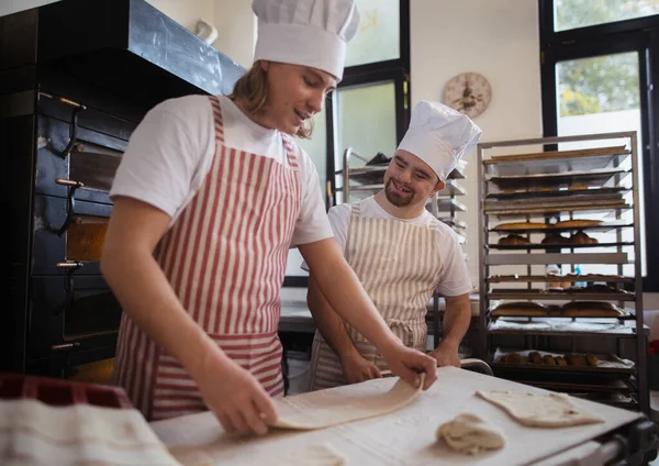 Man Syndrom Helping Prepair Bread Bakery His Colleague Concept Integration — Stock Photo, Image