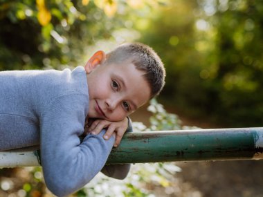 Portrait of happy boy in a forest.