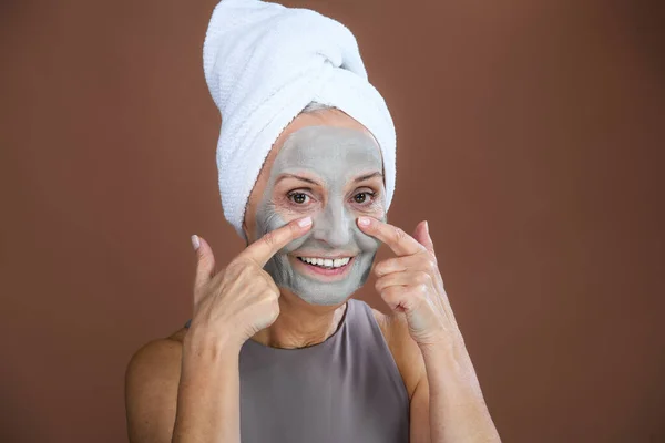 Portrait Excited Senior Woman Face Mask Selfcare Skin Routine Concept — Foto Stock