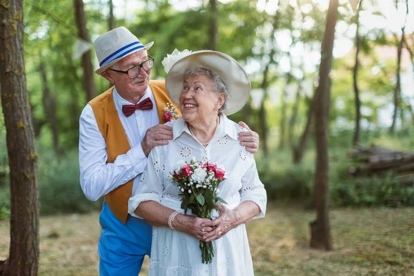 stock image Senior couple having marriage in nature during a summer day.
