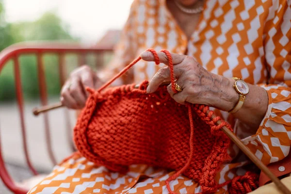 Close Senior Woman Sitting Outdoor Knitting Scarf — Photo