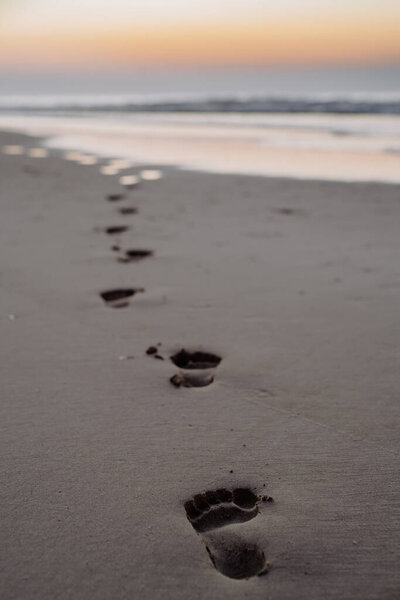 Close-up of a footprints on a beach.