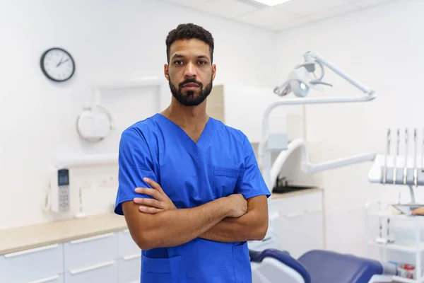 Portrait of young multiracial dentist at a private dental clinic.
