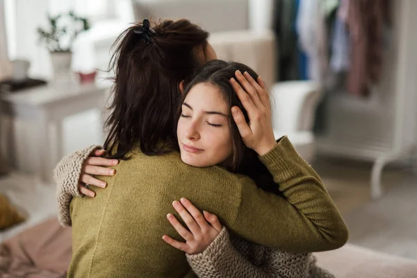 Young Teenage Girl Hugging Her Mother Home — Stock Photo, Image