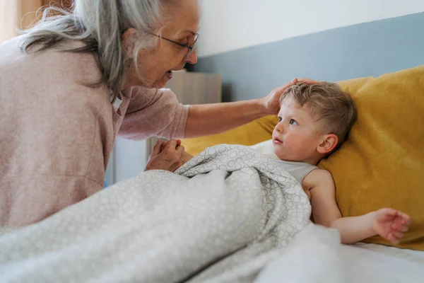 Grandmother Giving Her Grandson Bed — Stock Photo, Image