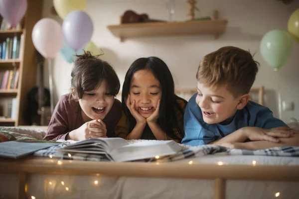 Three Happy Friends Reading Book Together Room — Stock Photo, Image