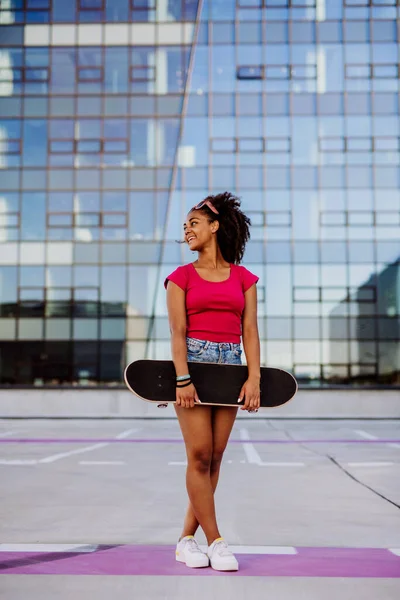 Multiracial Teenage Girl Backpack Skateboard Walking City Summer Day — Stok fotoğraf