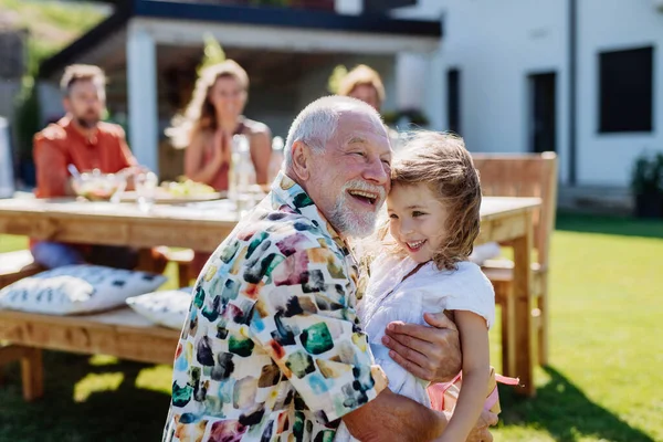 Happy Little Girl Giving Birthday Present Her Senior Grandfather Generation — Zdjęcie stockowe
