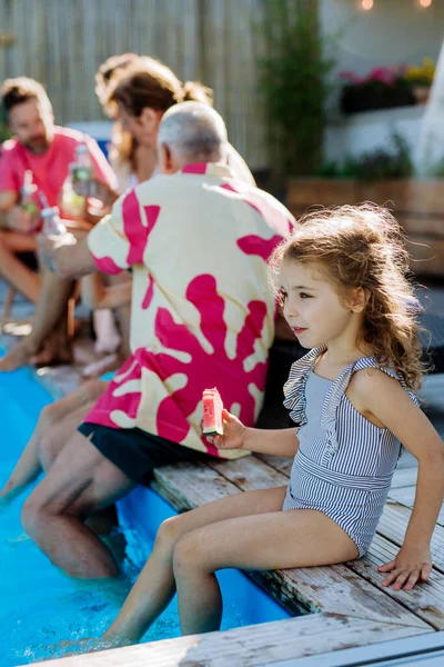 Multi Generation Family Enjoying Summer Time Sitting Backyard Pool — Stock Photo, Image