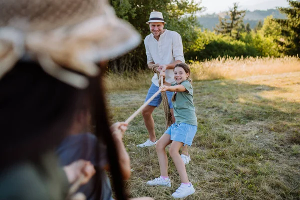 Young Family Happy Kids Having Fun Together Outdoors Pulling Rope — Foto Stock