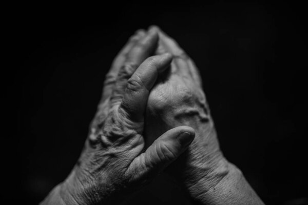 Close up of a wrinkled hands, black and white.