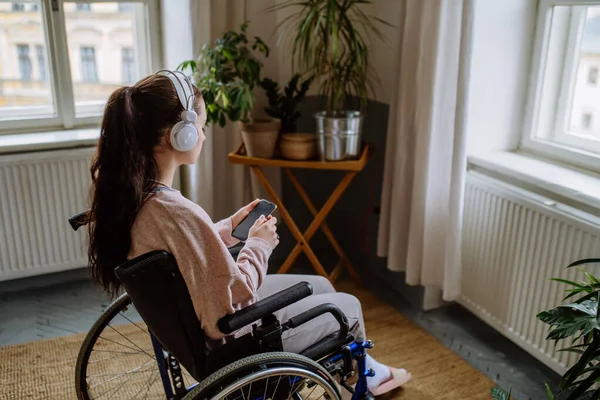 Unhappy Teenage Girl Sitting Wheelchair Looking Out Window — Stock Photo, Image