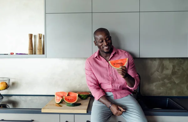 Multiracial Man Eating Watermelon His Kitchen Hot Summer — Fotografia de Stock