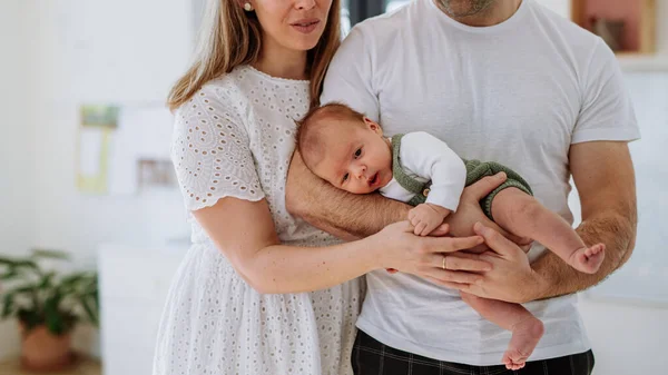 Happy Parents Cuddling Newborn Son — Stock Photo, Image