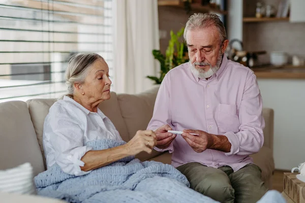 Senior Man Taking Care His Wife Flu Stock Image