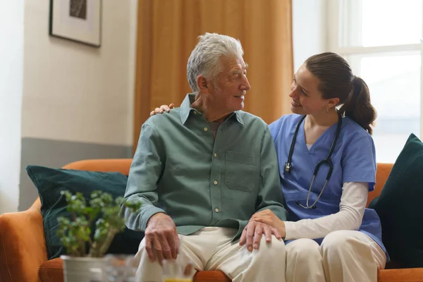 Young Nurse Taking Care Elderly Senior His Home Stock Picture