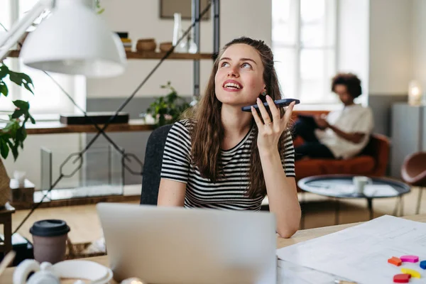 stock image Young woman working in coworking office.