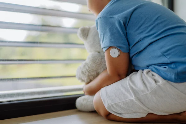 Diabetic Boy Continuous Glucose Monitor Sitting Window Holding His Stuffed — Stock Photo, Image