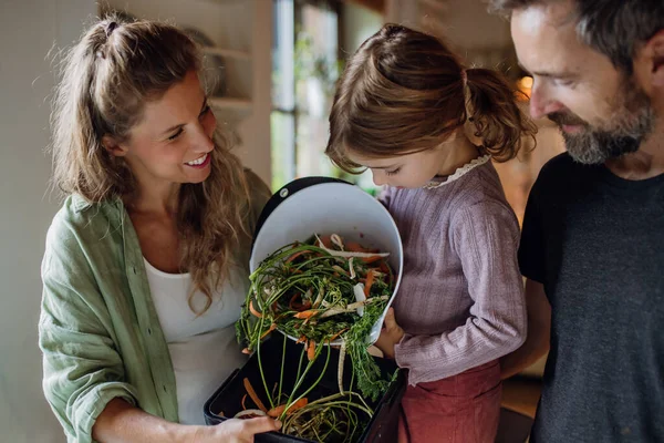 Girl Helping Parents Put Kitchen Waste Peel Leftover Vegetables Scraps — Stock Photo, Image