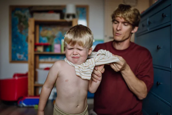 Father Putting Shirt Little Son Changing Pajamas Morning Boy Sad — Stock Photo, Image
