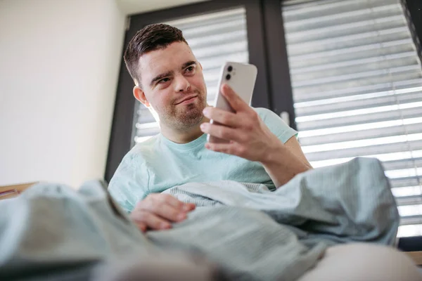 Young Man Syndrome Lying His Bed Looking Smartphone Morning Morning — Stock Photo, Image