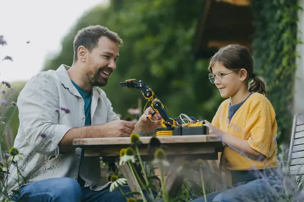 Young Girl Assembling Simple Robot Father Helping Her Father Supporting — Stock Photo, Image