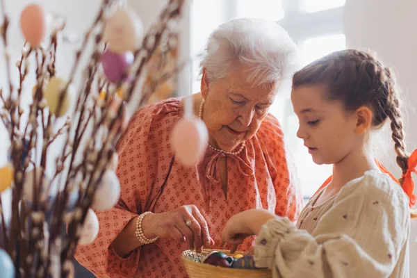 Grandmother Grandaughter Decorating Pussy Willows Branches Putting Easter Eggs Them — Stock Photo, Image