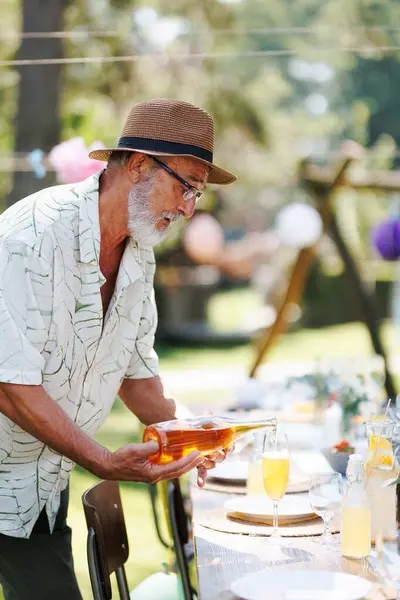 Elderly Handsome Man Preparing Refreshments Summer Garden Party Pouring Wine — Stock Photo, Image