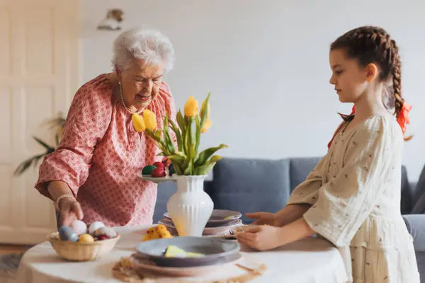 Grandmother Granddaughter Setting Table Traditional Easter Lunch Recreating Family Traditions — Stock Photo, Image