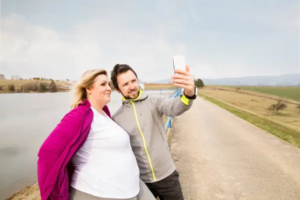 Two Friends Taking Selfie Smartphone Walk Nature Stockfoto