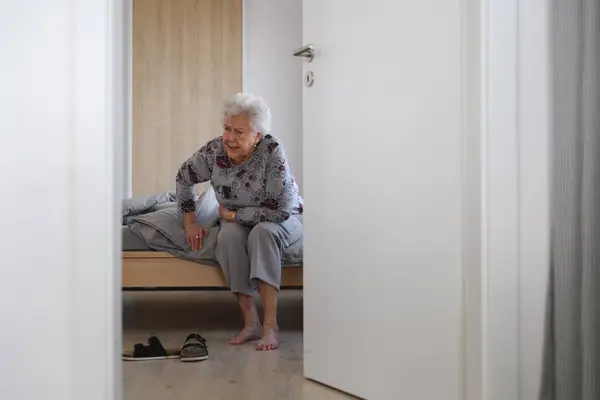 Senior Woman Trying Stand Bed Feeling Pain Holding Abdomen Stockbild