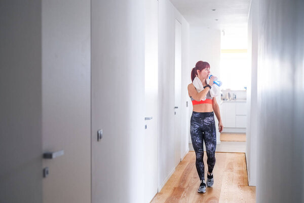 Beautiful Redhead Woman Drinking Water Resting Home Fitness Routine Home Royalty Free Stock Images