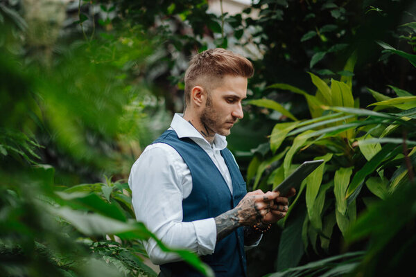 Businessman Tablet Standing Botanical Garden Middle Lush Green Foliage Looking Stock Image