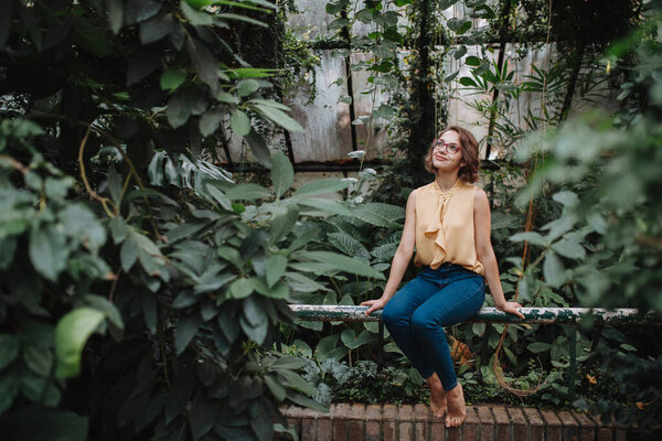 Woman Sitting Botanical Garden Middle Lush Green Foliage Royalty Free Stock Images