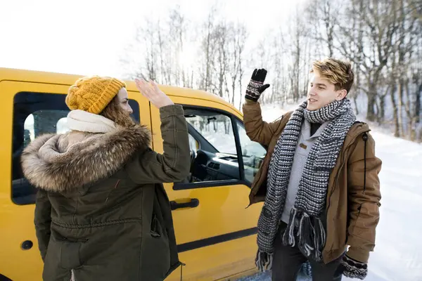 stock image Friends arrived at cabin where they spending winter Christmas holidays. Driving car through a snowy landscape.