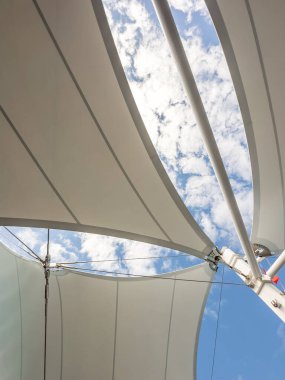 Billowing Sails on a Sailboat Under Blue Sky  Nautical Adventure Stock Photo