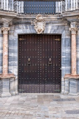 Aged Brown Double Wooden Door with Rustic Texture  Vintage Architectural Detail