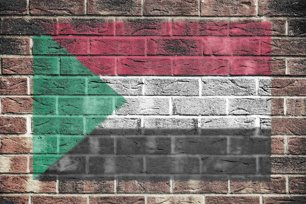 Una Bandera Sudán Sobre Fondo Pared Ladrillo —  Fotos de Stock