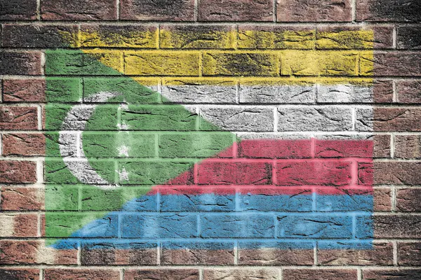 stock image A Comoros flag on an old brick wall background