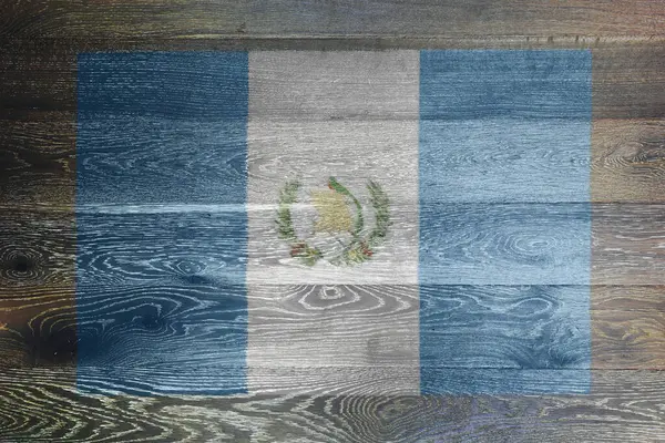 stock image A Guatemala flag on rustic old wood surface background