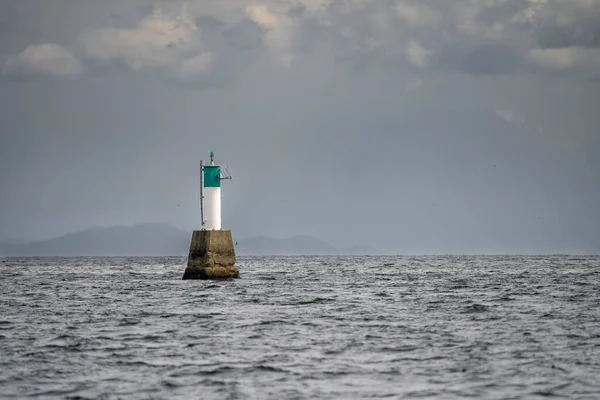 stock image Clark Rock green and white seamark in the Strait of Georgia, , near Nanaimo, Vancouver Island, British Columbia, Canada.