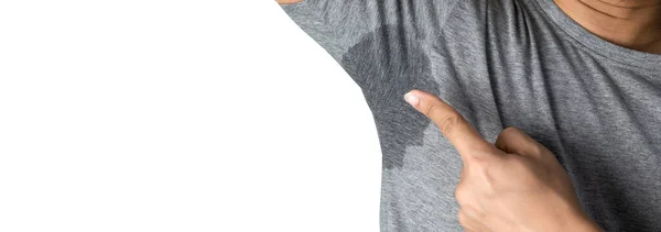 汗流浃背的男人 T恤上的污渍湿淋淋的腋窝与灰色的自由空间相抗衡 图库图片