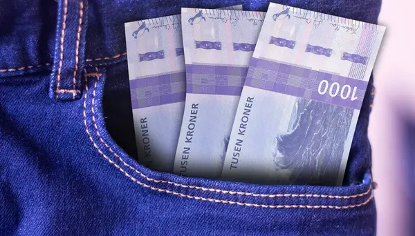 stock image Bunch of Norway 1000 Kroner banknotes in a jeans pocket a concept of spending