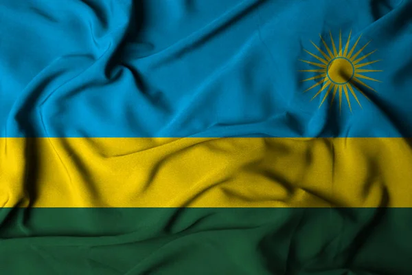 Ruanda bayrağının seçici odak noktası, el sallayan kumaş dokusu. 3d illüstrasyon