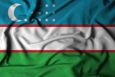 Sallanan kumaş dokusuyla Özbekistan Bayrağının seçici odak noktası. 3B illüstrasyon