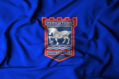 IPSWICH Town FC logosunun seçici odak noktası. Ipswich şehri futbol kulübü, Suffolk, İngiltere. Akan kumaş dokusuyla. 3B illüstrasyon