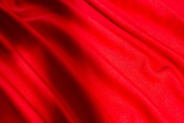 futbol forması malzemesinin kırmızı lüks kumaş dokusu ya da İpek Kumaş dokusu üzerine odaklanın.